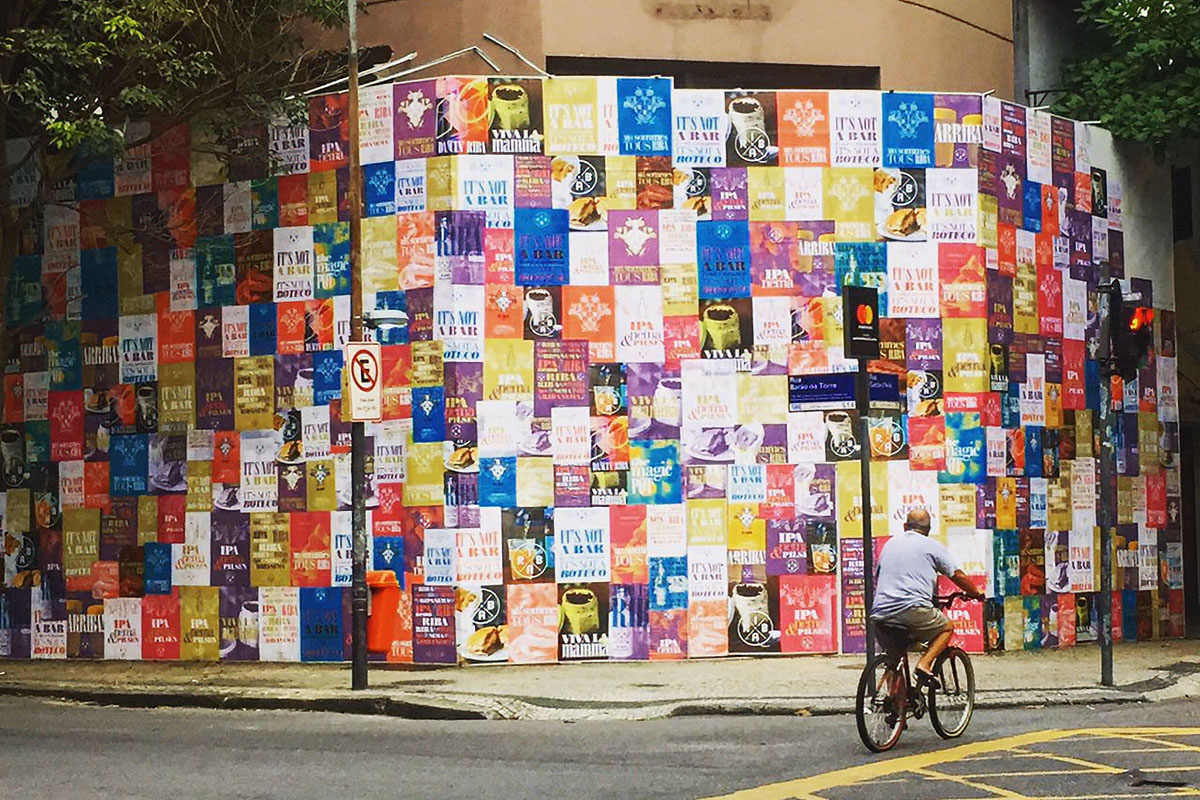 Riba construction hoardings covered in colourful paste-ups