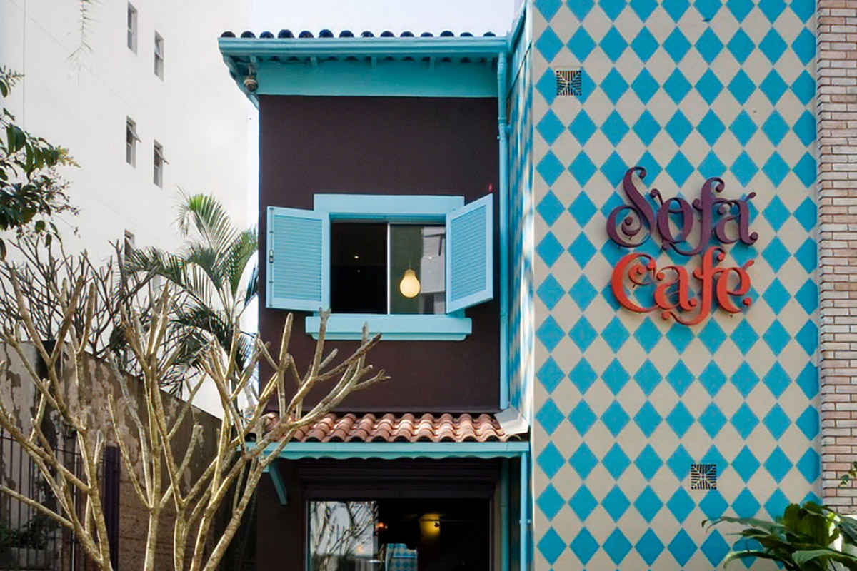 Sofá Café façade with blue diamond tiles and the brand sign