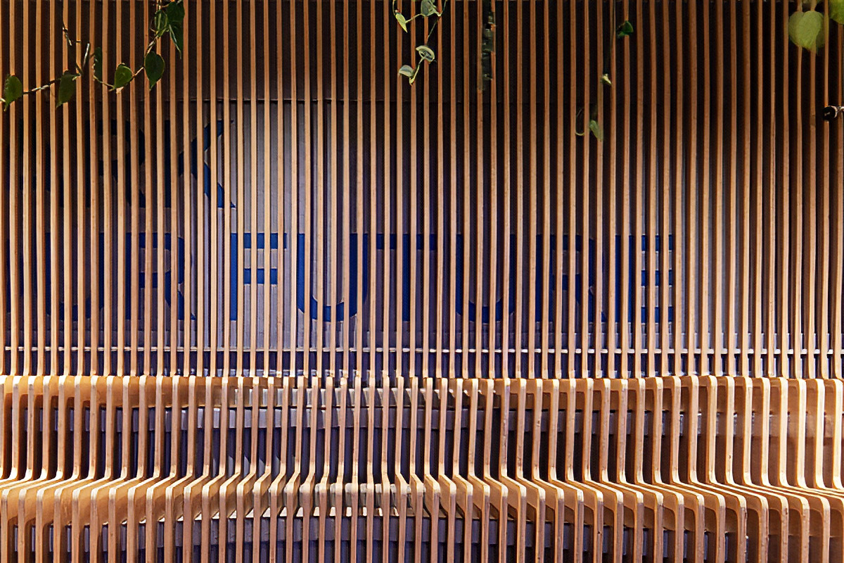 Stark Bank's headquarters office, with a meeting table and the slatted wall in the background